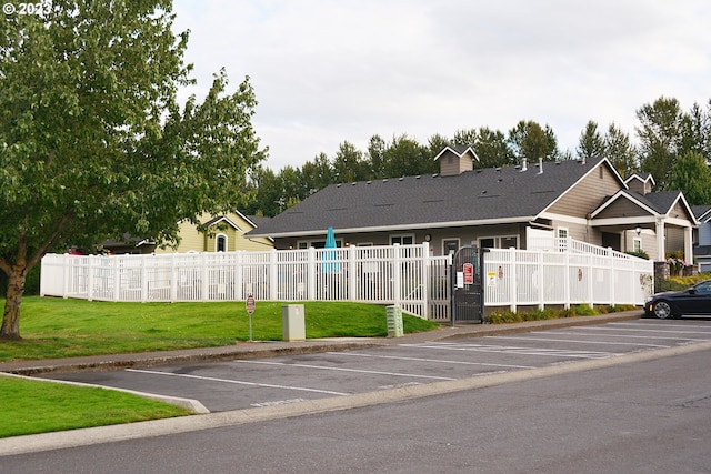 view of asphalt street with curbs