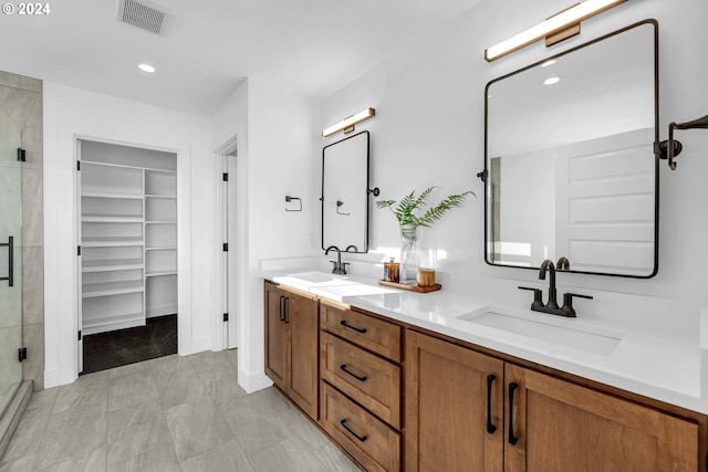 bathroom with vanity and an enclosed shower