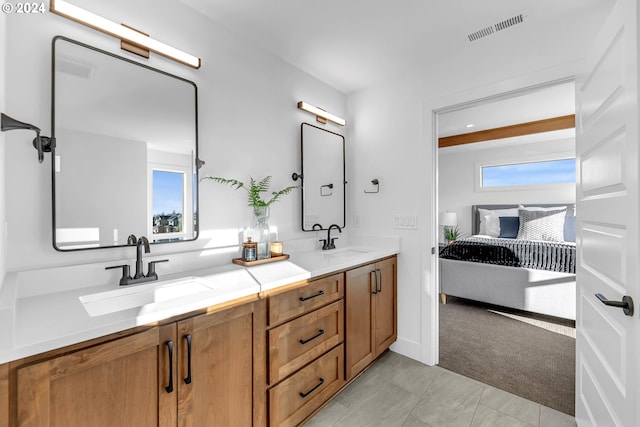 bathroom with tile patterned flooring and vanity