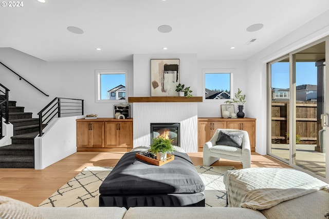 living room with light hardwood / wood-style flooring