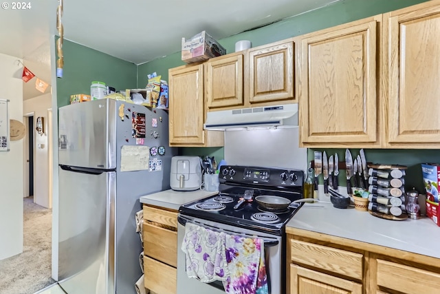 kitchen featuring light brown cabinets and stainless steel appliances