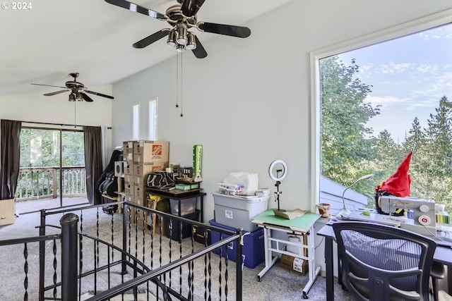 interior space featuring ceiling fan, carpet floors, and vaulted ceiling