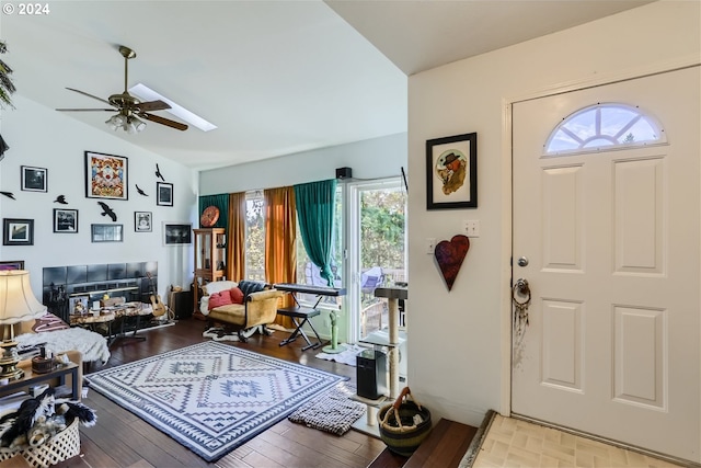 entryway featuring ceiling fan, light hardwood / wood-style floors, and vaulted ceiling