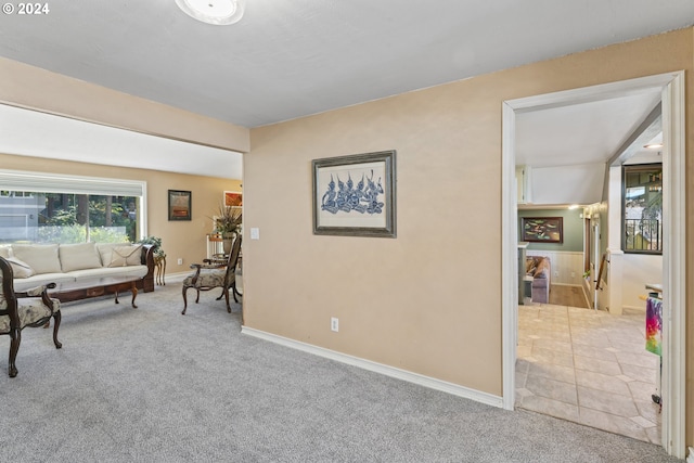 living room with baseboards and carpet flooring