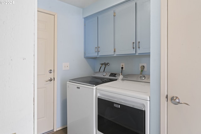 laundry room featuring washer and clothes dryer and cabinet space