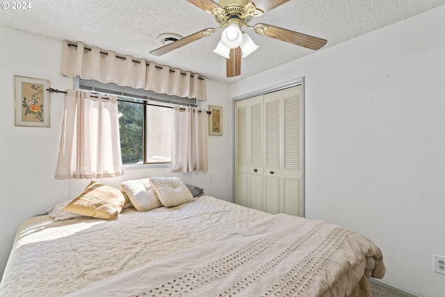 bedroom with a closet, a textured ceiling, and a ceiling fan