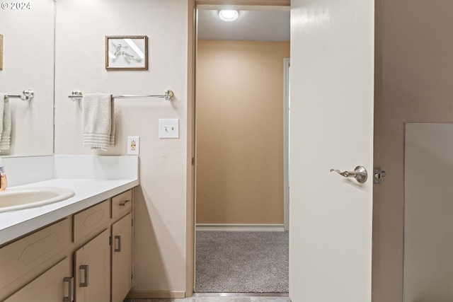 bathroom with baseboards and vanity