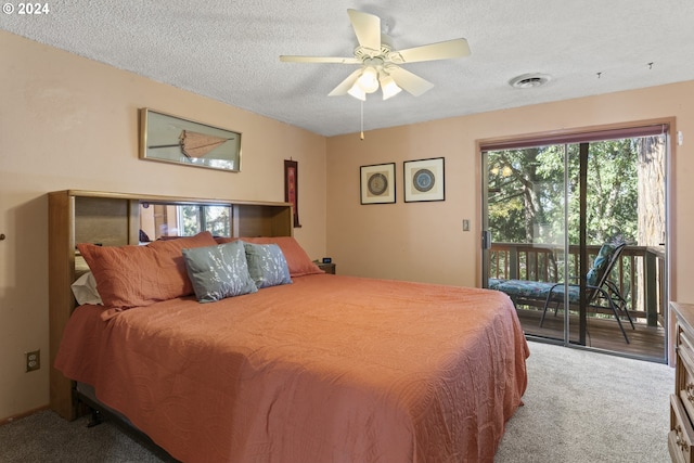 bedroom featuring visible vents, a textured ceiling, carpet, and access to outside