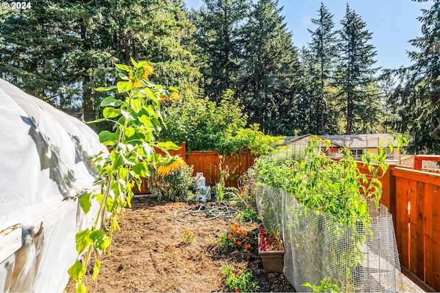 view of yard featuring a garden and fence