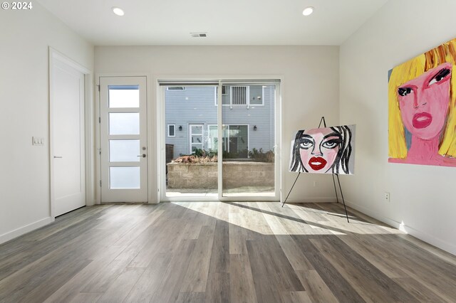 interior space featuring plenty of natural light and hardwood / wood-style flooring