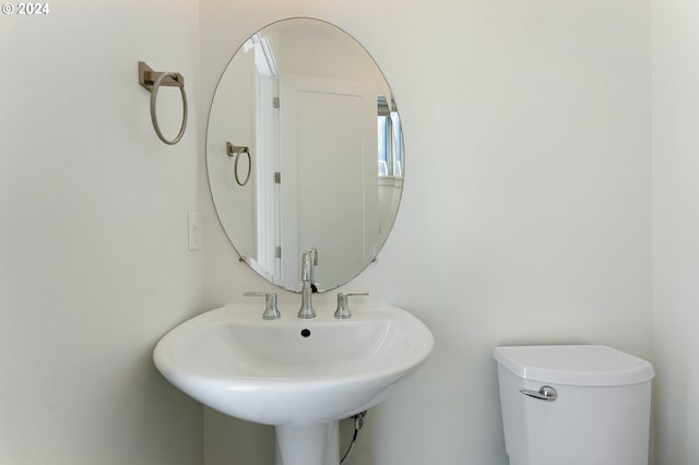 bathroom with toilet and sink