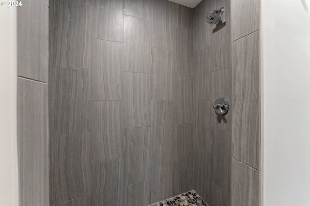 bathroom with tiled shower