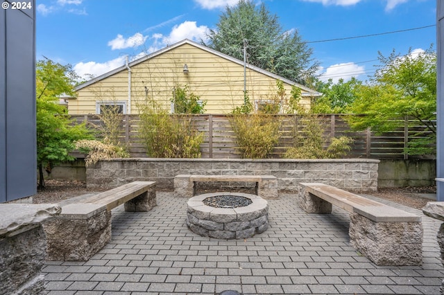 view of patio / terrace featuring a fire pit