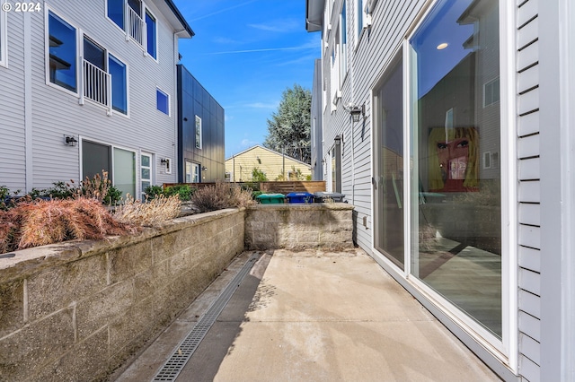 view of side of home featuring a patio