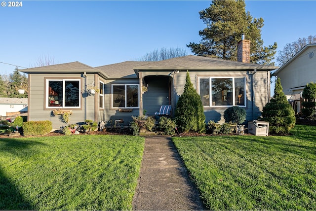 bungalow with a front yard