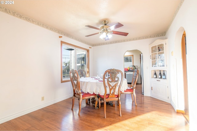 dining space featuring ceiling fan and light hardwood / wood-style flooring