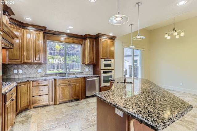 14815 SE Donley Ln, Happy Valley, OR 97086 - kitchen featuring stainless steel appliances, a sink, decorative backsplash, healthy amount of natural light, and recessed lighting