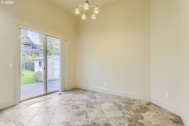 empty room with an inviting chandelier