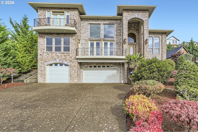 14815 SE Donley Ln, Happy Valley, OR 97086 - view of front of house with a balcony, an attached garage, driveway, and french doors