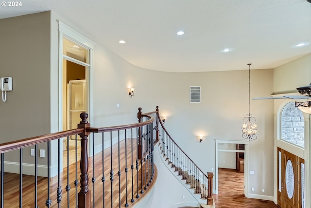 interior space with hardwood / wood-style flooring and a notable chandelier