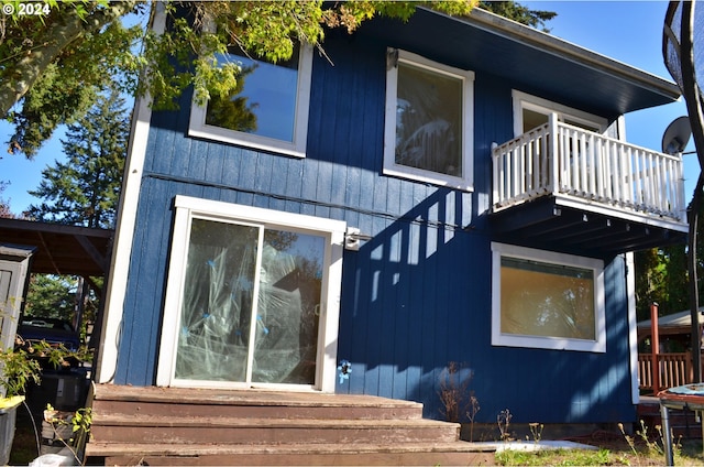 view of front of home with a balcony