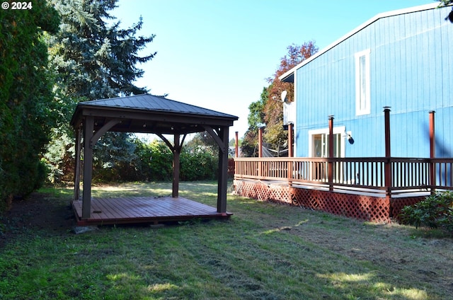 view of yard featuring a gazebo and a deck