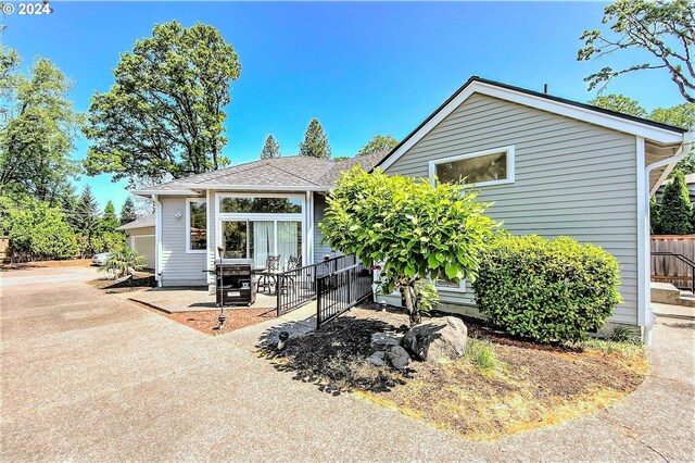 back of property with a patio area