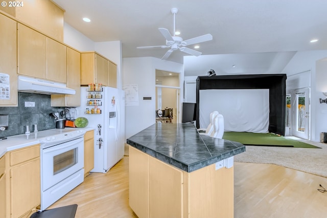 kitchen featuring backsplash, vaulted ceiling, white appliances, light brown cabinetry, and light wood-type flooring