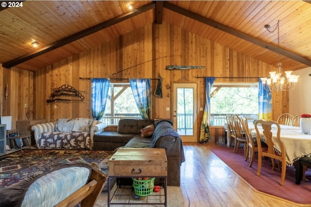 living room featuring high vaulted ceiling, wood-type flooring, beam ceiling, wooden ceiling, and a notable chandelier