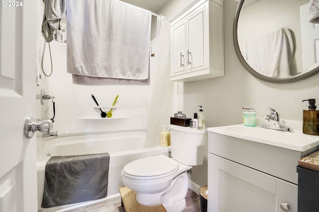 full bathroom with hardwood / wood-style floors, oversized vanity, shower / tub combo, and toilet