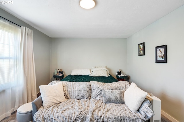 bedroom with hardwood / wood-style flooring