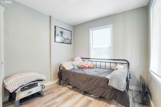 bedroom with light wood-type flooring