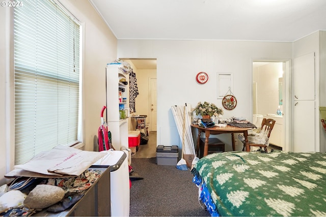 carpeted bedroom with ornamental molding