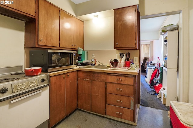 kitchen with sink and white range with electric cooktop