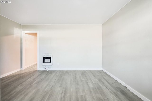 unfurnished living room with hardwood / wood-style flooring