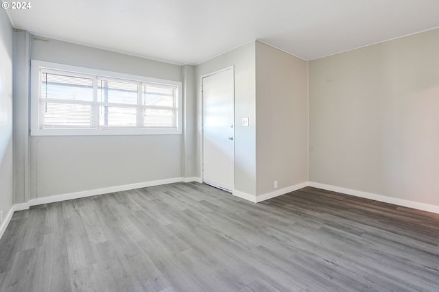 empty room with hardwood / wood-style flooring