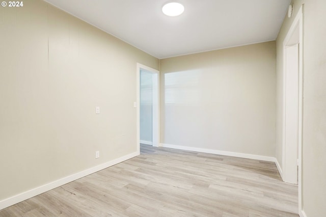 spare room featuring light wood-type flooring