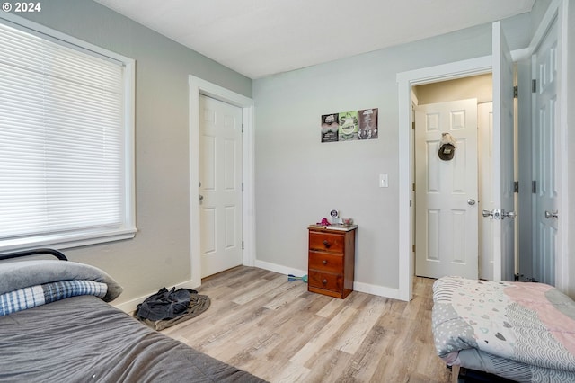 bedroom with light hardwood / wood-style floors