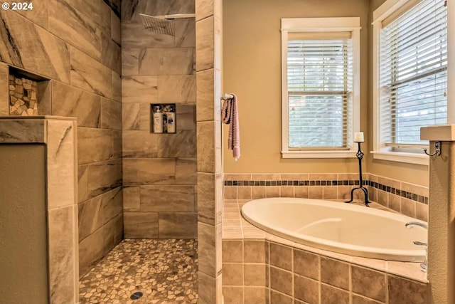 bathroom featuring plus walk in shower