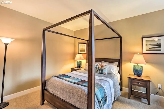 bedroom featuring light carpet