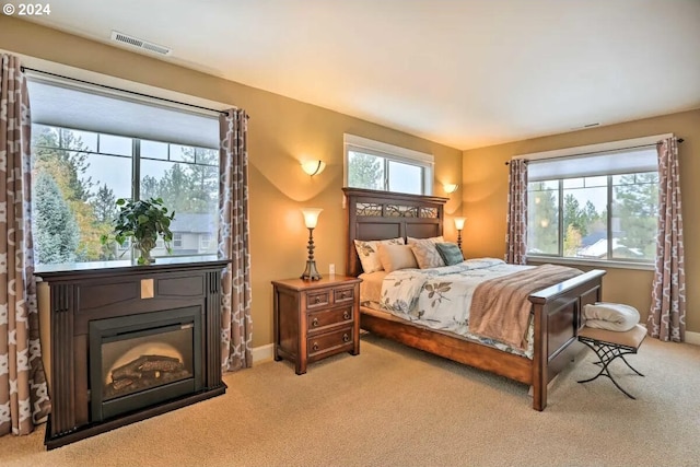 bedroom with light colored carpet