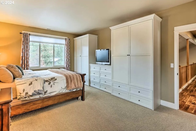 bedroom featuring light carpet