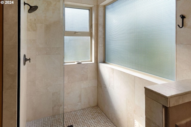 bathroom with tile walls and tiled shower