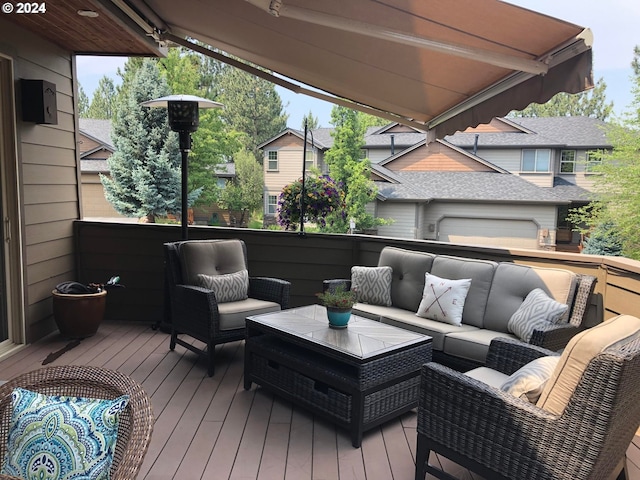 wooden deck featuring an outdoor hangout area