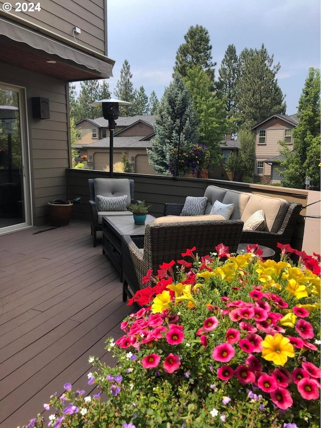 wooden deck with an outdoor hangout area