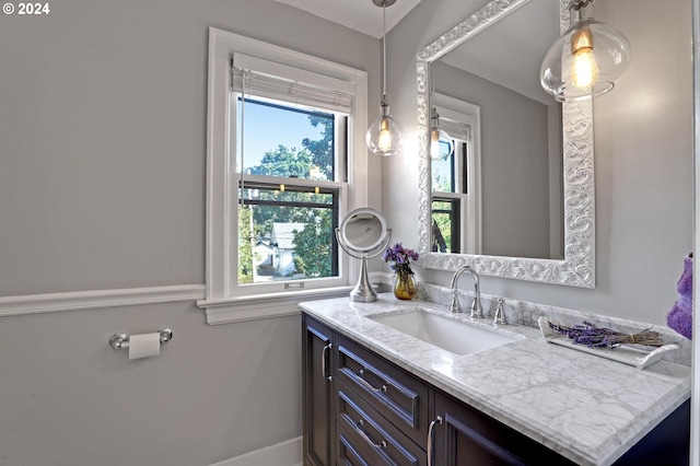 bathroom with vanity and baseboards