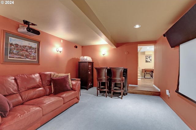 carpeted home theater featuring baseboards, beamed ceiling, and recessed lighting