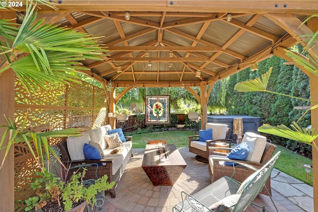 view of patio / terrace featuring a gazebo, outdoor lounge area, and a hot tub