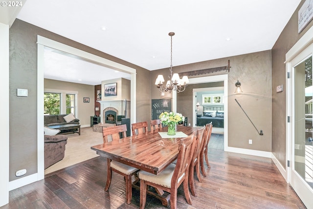 dining room featuring a notable chandelier and hardwood / wood-style flooring