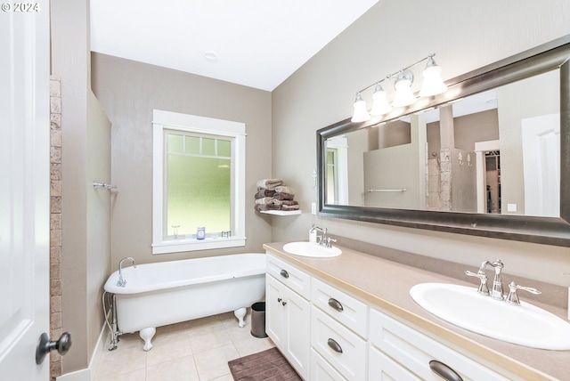 bathroom with vanity, a bathtub, and tile patterned floors